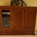 F31. Media cabinet. 50"h x 62.5"w x 23"d  